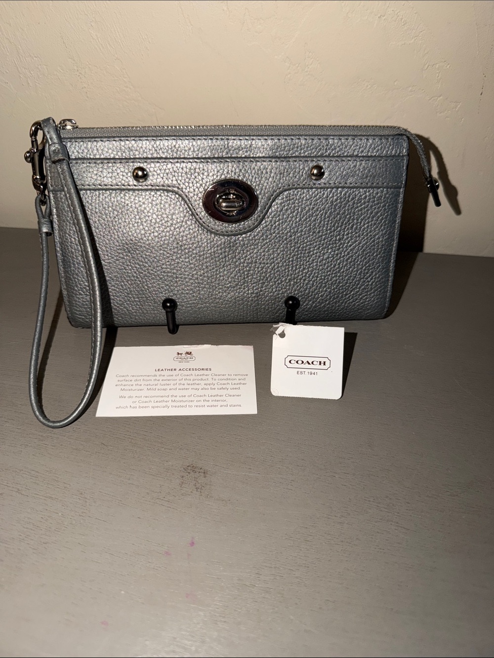 COACH Silver Pebbled Leather Wristlet with Turn-Lock